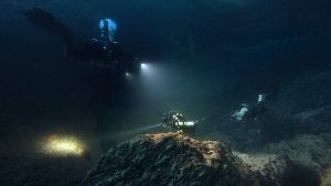 Divers exploring Dwejra underwater